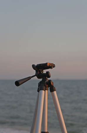 Tripod on the beach when sunsetの写真素材
