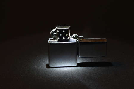 opened classical and old lighter in the lightの写真素材