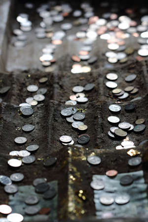 Thai coin and bill donate in the Buddhaの写真素材