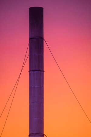 Shade of the sky behind the smoke stackの写真素材