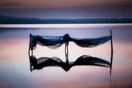 Reflect of the net in the lakeの写真素材