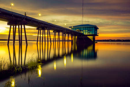 Twilight beside the pipeline of water supplyの写真素材