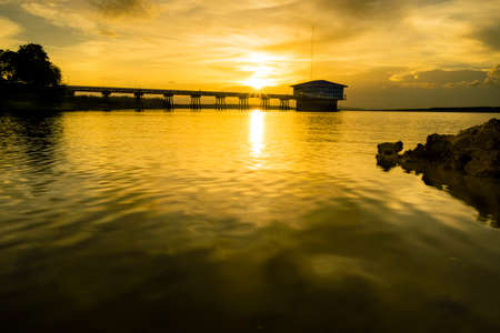 Golden light before sunset at the lakeの写真素材