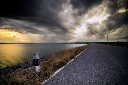 Cloudy sky over the roadの写真素材
