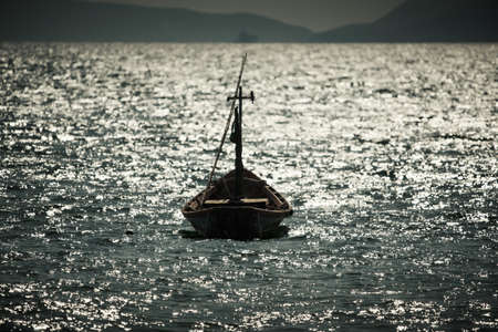 A boat anchoring in the calm sea