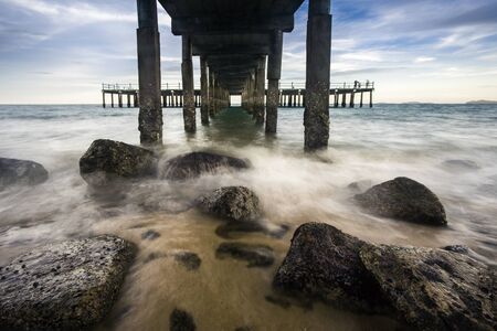 The wave under the pierの写真素材
