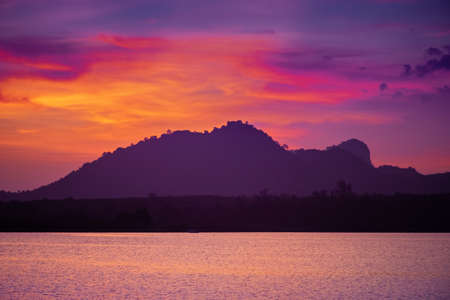 Landscape of the sunset behind the hillの写真素材