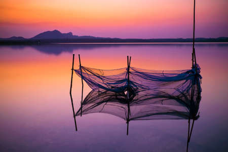 The net and its reflection in the waterの写真素材