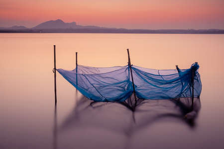 The net at the lake in twilight timeの写真素材