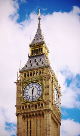 Big Ben with fluffy white clouds and blue sky