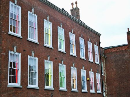 house fassade with colored lights in windows