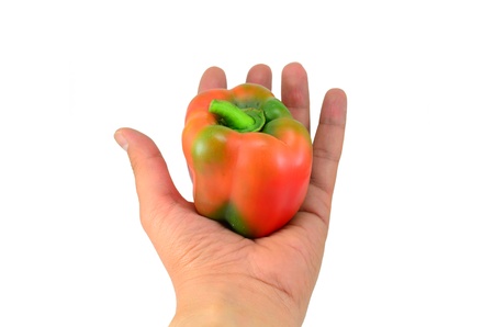 Green pepper held in handの写真素材