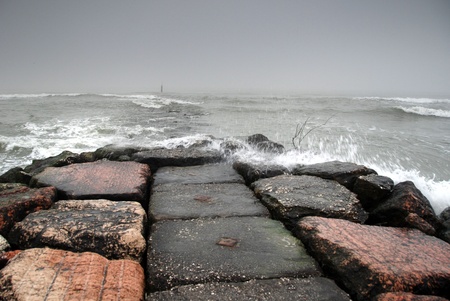 Stone pier in a stormの写真素材