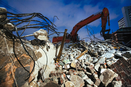 Twisted metal with an Excavator at Nightの写真素材