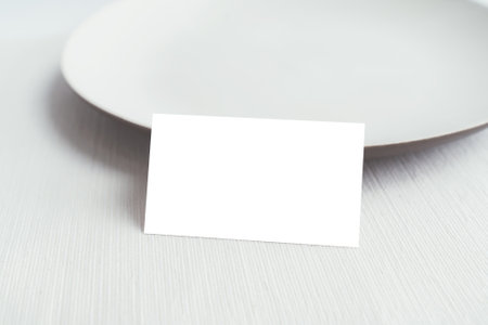 Empty white plate on wood table with copy space for your text.の写真素材