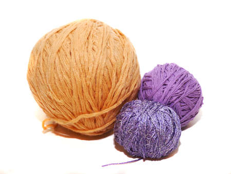 Clews of color yarn at the white background