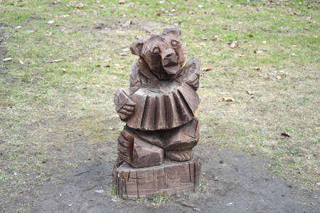 Wooden bear playing button-accordionの写真素材