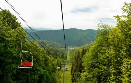 Cable car leading to the mountains in summerの写真素材