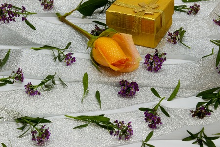 abstraction of small violet flowers on a silver ribbonの写真素材