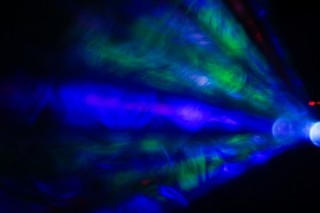 disco background. color lasers in smoke. Side viewの写真素材