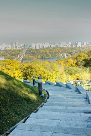 Steps in the park. autumn. a landscape of steps that lead to the cityの写真素材