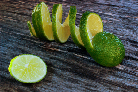 freshly sliced lime on a wooden surface. Close-up, side viewの写真素材