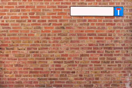 Brick wall background texture with cul-de-sac sign, good for graffitiの写真素材