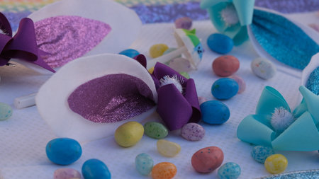 close up of colorful easter eggs decoration on white tablecloth.