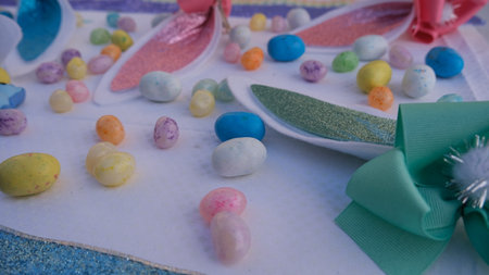 Easter table setting with colored eggs and candies. Selective focus.