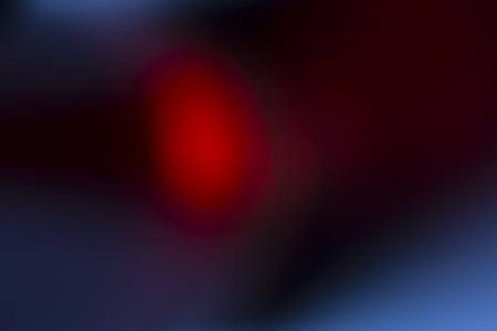 Dark overlay background of red LED lights with bokeh effect. Includes copy space.の写真素材