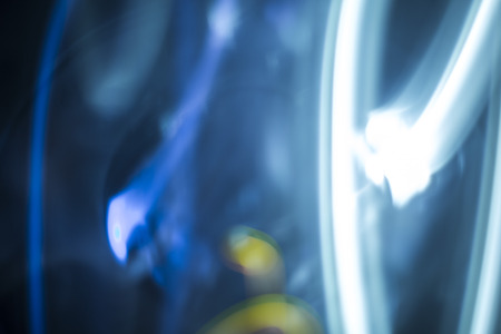 Chaotic background with radial directions of light streaks in blue and white for concept about movementの写真素材