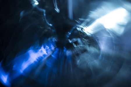 Chaotic background with radial directions of light streaks in blue and white for concept about movementの写真素材