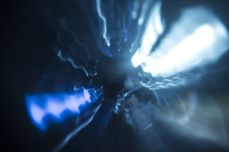 Chaotic background with radial directions of light streaks in blue and white for concept about movementの写真素材