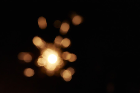 Bright yellow line of sparkling lights in darkness. Use for abstract celebration concept.の写真素材