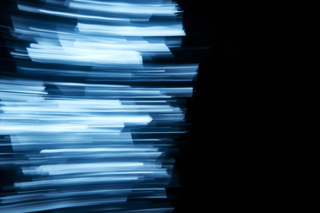 Blurry wrinkled reflective surface for background about motion in the darkness or technology