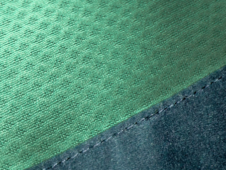 Green wavy fabric texture Background with copy space.