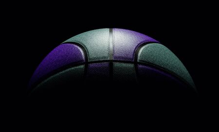 Front view on mint and black colored single basketball sitting on black background. dramatic...