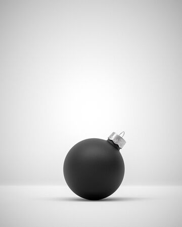 Matte red Christmas ball centered on a light grey background for seasonal Holiday celebrations and themesの写真素材