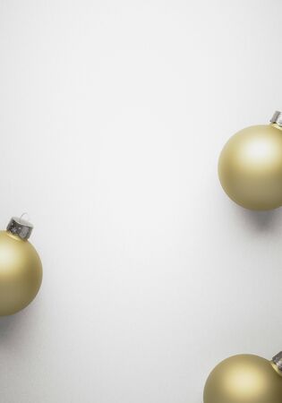 Matte gold Christmas baubles on white background with gradient for modern design winter holiday card. Design Template or art Greeting Card.の写真素材