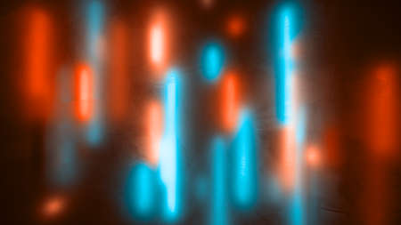 Abstract colorful background. Defocused vertical cyan and orange neon light lines behind frozen...