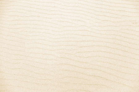 Close up view of color stripes made by water waves. Sand stripes texture background. Summer vacation, holiday at sea concept.の写真素材