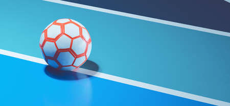 White orange futsal ball on blue indoor soccer field concept backgroundの写真素材