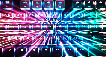 Abstract colorful background with backlighted computer keyboard theme. Numbers and letters as basis...