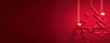 Group of three glass Christmas balls. Tree contour shape baubles hanging against burgundy red background. Christmas decoration, festive atmosphere concept. Selective focus, copy space.の写真素材