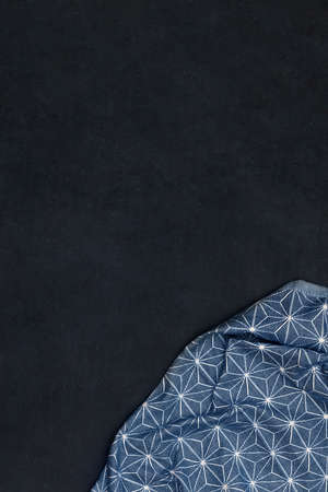 Star pattern on textile cloth. Pattern on wipe against dark background. Space for adding your text...