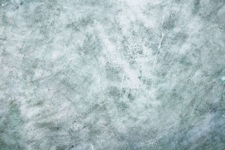 Gray rustic cement wall background. Textured concrete surface. Blank template for your text or...
