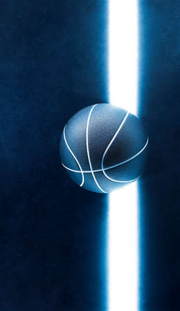 Top down view of basketball ball and light glow line on dark field background. Abstract theme of neon sport equipment. Moody design concept idea.の写真素材