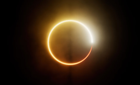 Yellow neon circle shining abstract shape isolated in black background. Abstract neon illuminated 3d vector circular object backgroundの写真素材