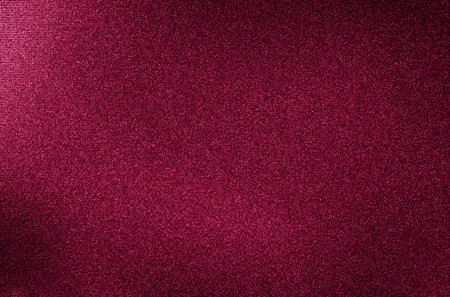 Red silky texture surface or curtain material. Sunlit front view as background with copy space.の写真素材