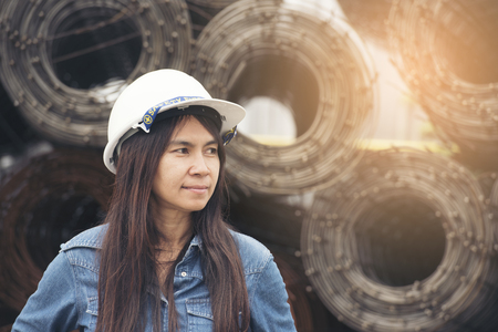 Beautiful Engineer wear White helmet for security work. Construction and Engineering Concept.の写真素材